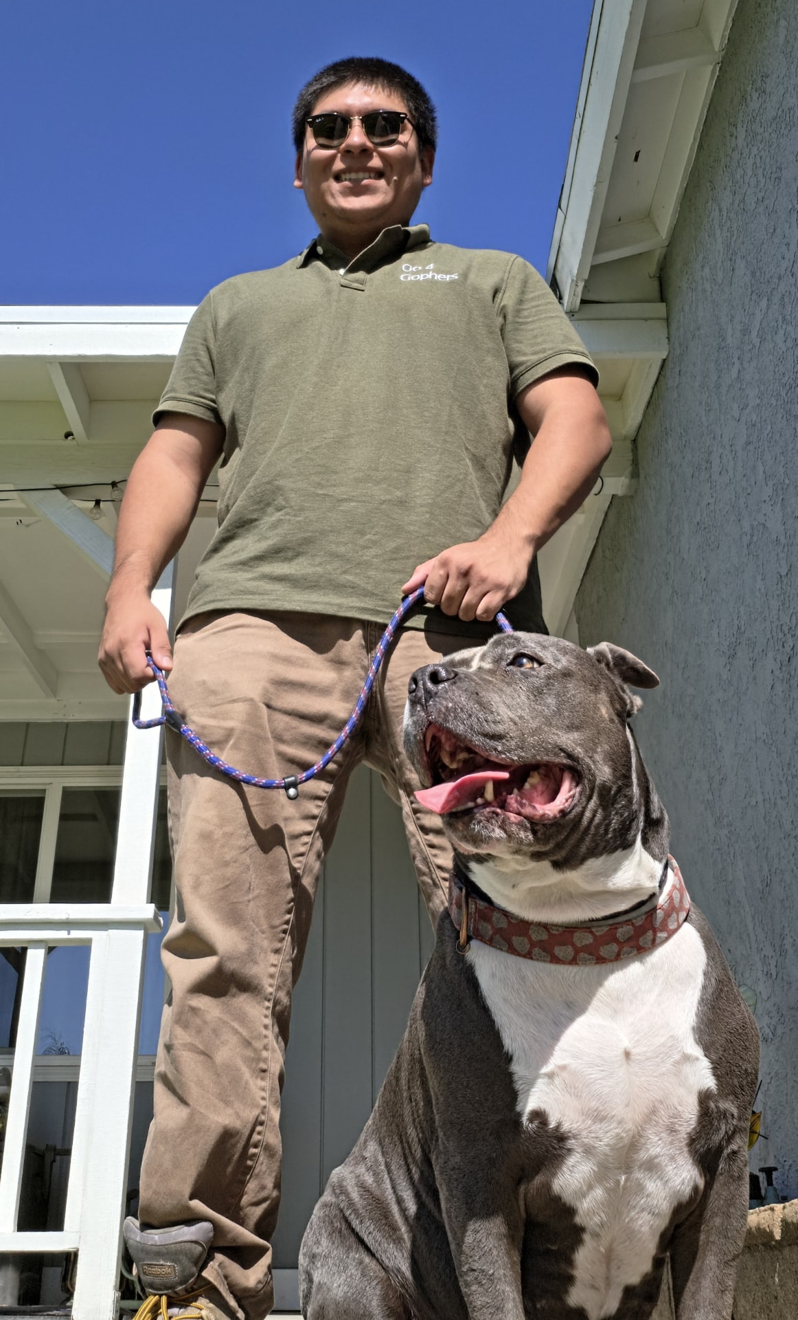 Marco Silguero, owner of Go 4 Gophers, with his pitbull